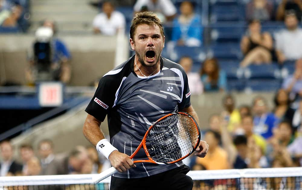 Stan Wawrinka, of Switzerland, reacts after defeating Thomaz Bellucci, of Brazil, 6-3, 6-4, 3-6, 7-6 (1) during the second round of the U.S. Open tennis tournament in New York.