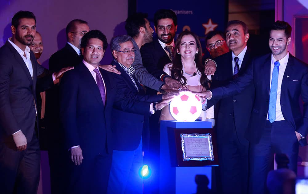 Reliance Foundation Chairman Nita Ambani and All India Football Federation President Praful Patel along with co-owners of eight franchises from around the country, stand together for a photograph during the official launch of the Indian Super League (ISL) in Mumbai.