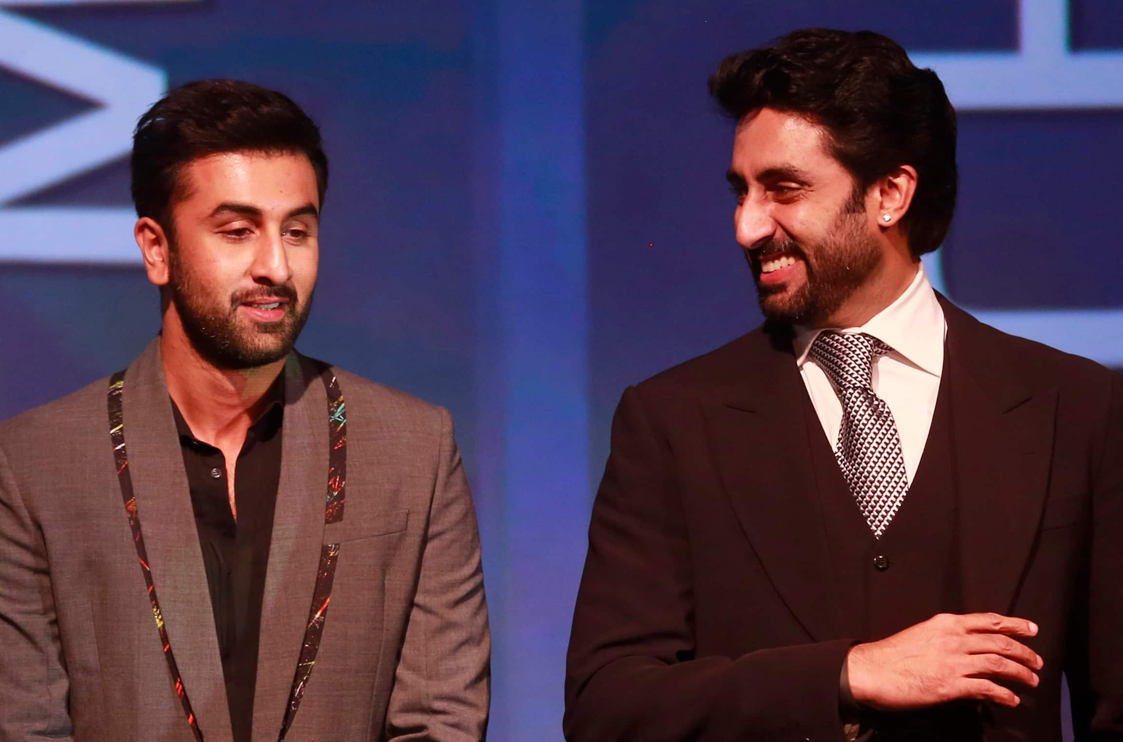 Bollywood actor and co-owner of Mumbai City FC Ranbir Kapoor, listens to Bollywood actor and co-owner of Team Chennai Abhishek Bachchan during the official launch of the Indian Super League (ISL) in Mumbai.