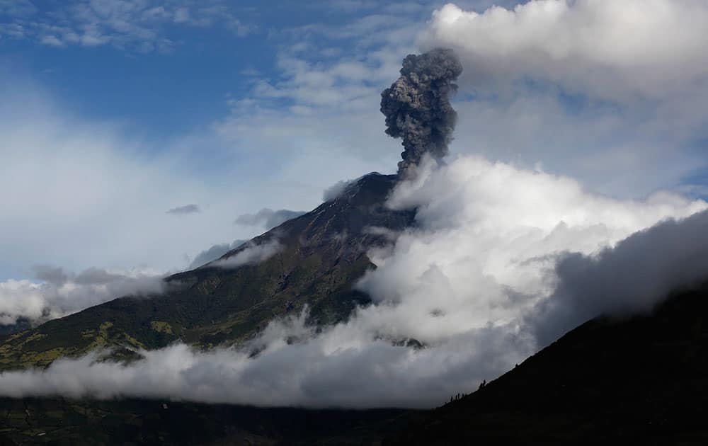 The Tungurahua volcano blows steam and ash, seen from El Tingue, Ecuador