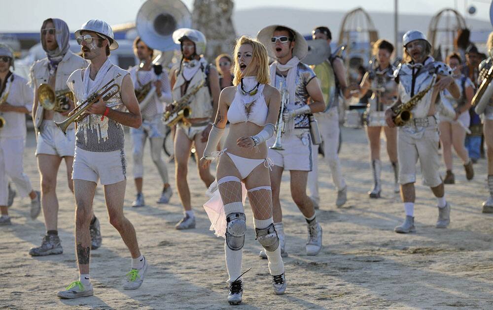 Participants enjoy the Burning Man festival in the Black Rock Desert of Gerlach, Nev. Organizers call Burning Man the largest outdoor arts festival in North America, with its drum circles, decorated art cars, guerrilla theatrics and colorful theme camps.