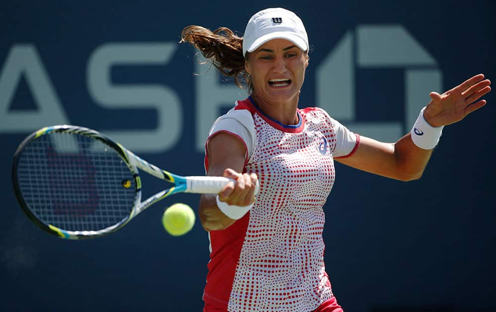 Monica Niculescu, of Romania, returns a shot to Barbora Zahlavova Strycova, of the Czech Republic, during the second round of the 2014 US Open tennis tournament in New York.