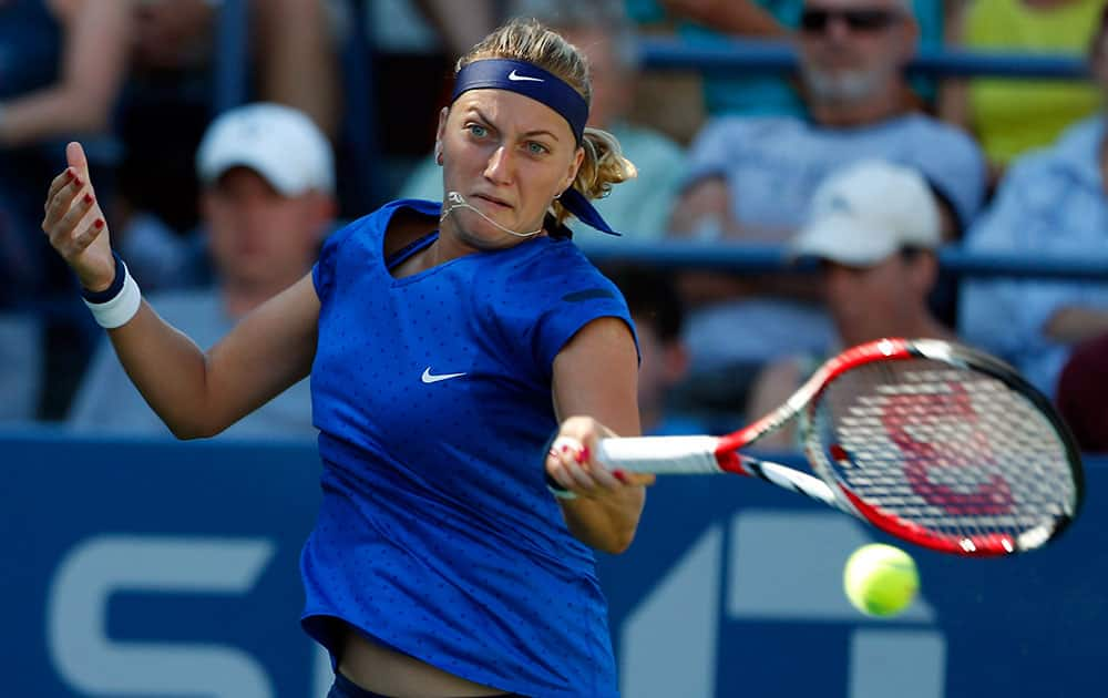 Petra Kvitova, of the Czech Republic, returns a shot against Petra Cetkovska, of the Czech Republic, during the second round of the 2014 US Open tennis tournament in New York.