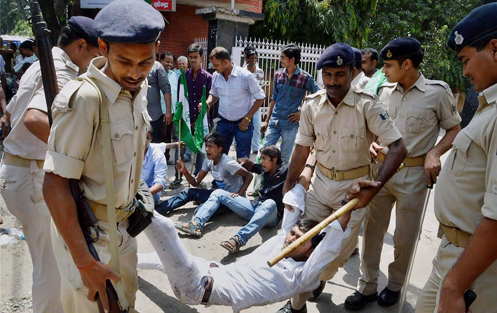 Police detain activists of Chhatra Samagam, students wing of JD-U, during protest at Bharat Sanchar Nigam office in Patna.