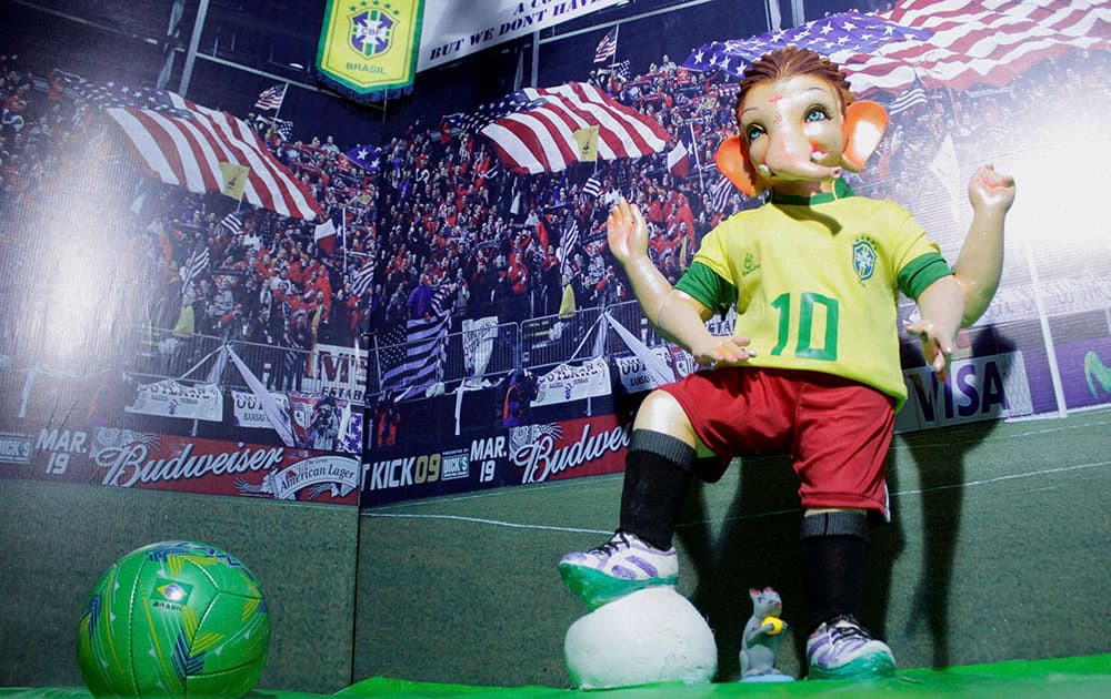 A Ganesh idol dressed in the outfit of the Brazilian football team, ahead of Ganesh Chaturthi festival, in Navi Mumbai.