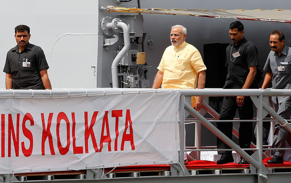 PM Modi inducts the largest indigenously built warship INS Kolkata in Mumbai.
