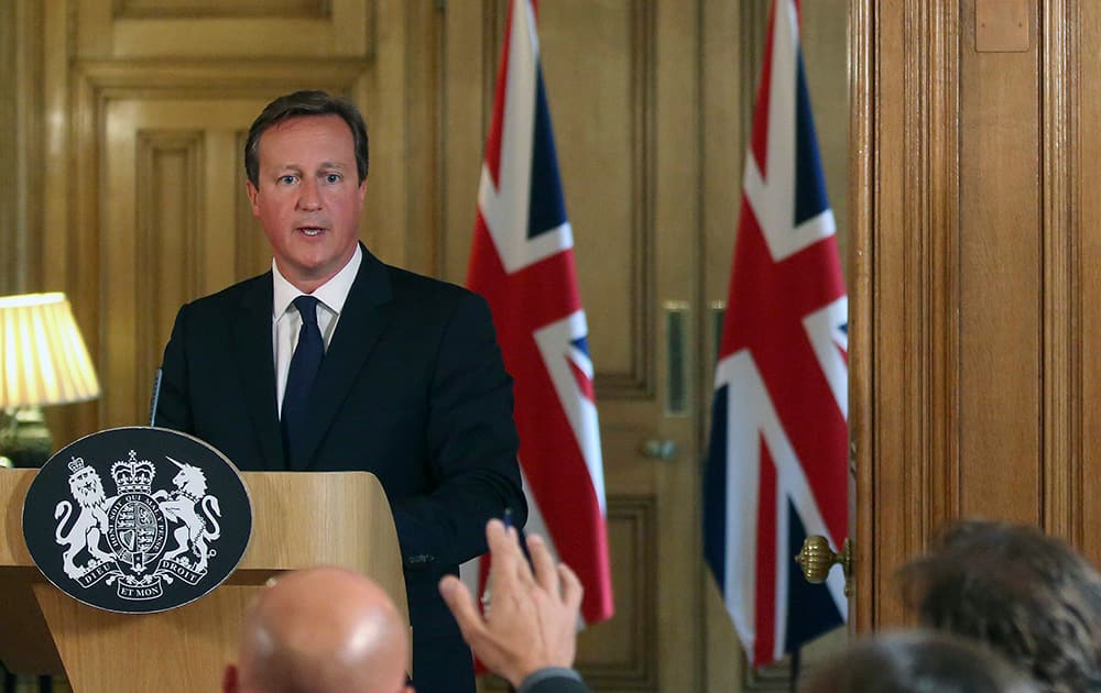 British Prime Minister David Cameron looks to answer questions from journalists during a media conference in Downing Street, London.