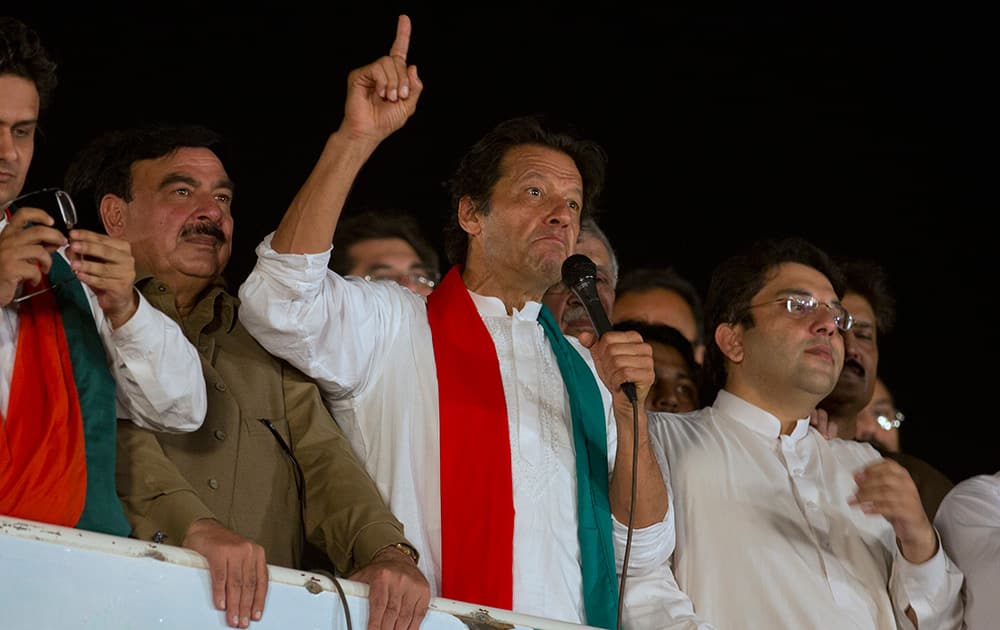 Pakistani cricket celebrity-turned-politician Imran Khan addresses his supporters during an anti-government sit-in protest in Islamabad, Pakistan.