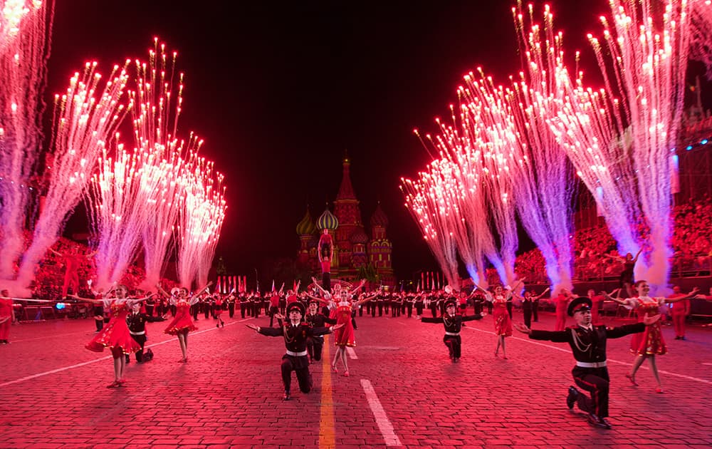 Fireworks explode as Russian military cadets perform during the rehearsal of 'Spasskaya Tower' International Military Orchestra Music Festival at the Red Square in Moscow, Russia.