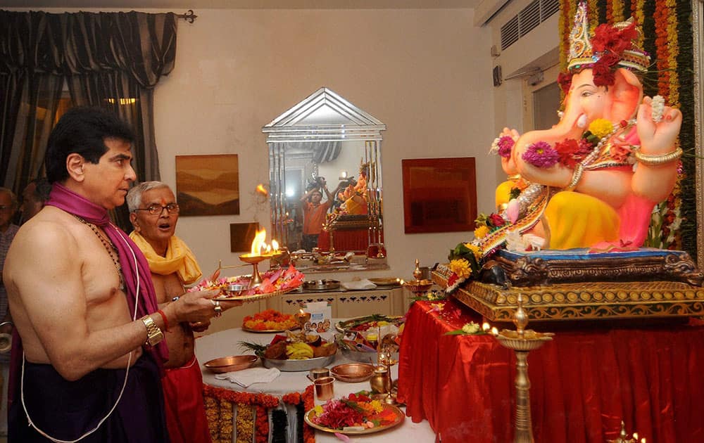 Bollywood actor Jeetendra offers prayers to a Ganesh idol at his residence on the occasion of Ganesh Chaturthi, in Mumbai.