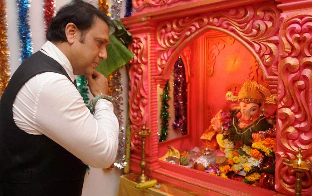 Bollywood actor Govinda offers prayers to a Ganesh idol at his residence on the occasion of Ganesh Chaturthi, in Mumbai.