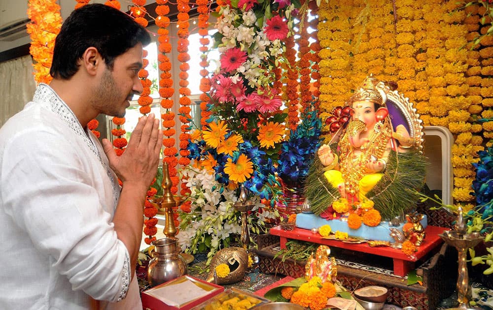 Bollywood actor Shreyas Talpade offers prayers to a Ganesh idol at his residence on the occasion of Ganesh Chaturthi, in Mumbai.