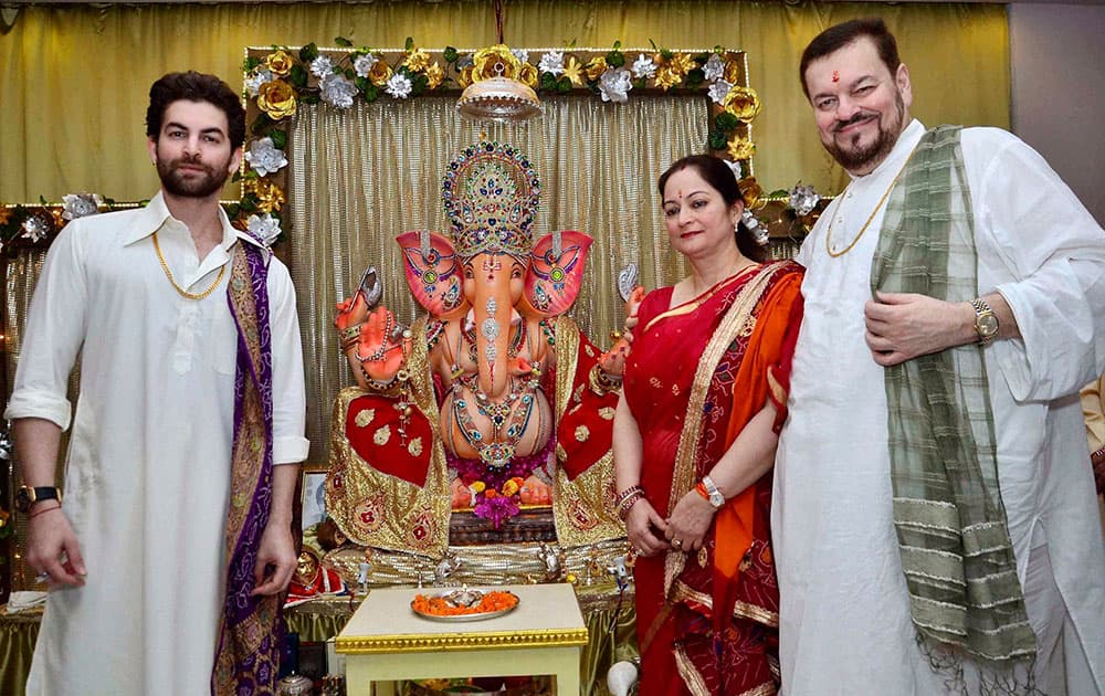 Singer Nitin Mukesh with his son actor Neill Nitin Mukesh celebrating Ganesh Chaturthi at their residence in Mumbai.