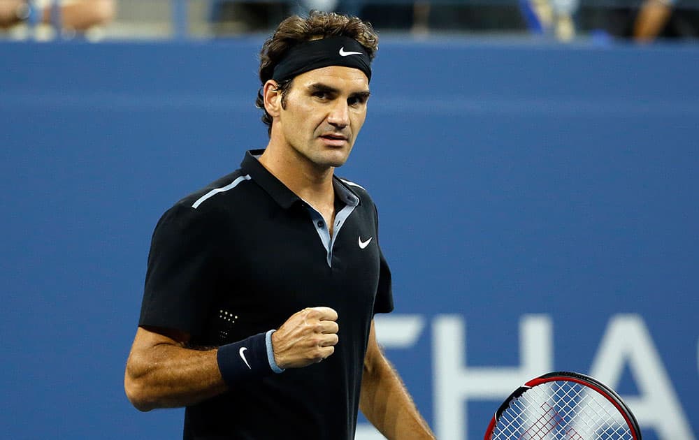 Roger Federer, of Switzerland, reacts after winning a point against Sam Groth, of Australia, during the second round of the US Open tennis tournament.