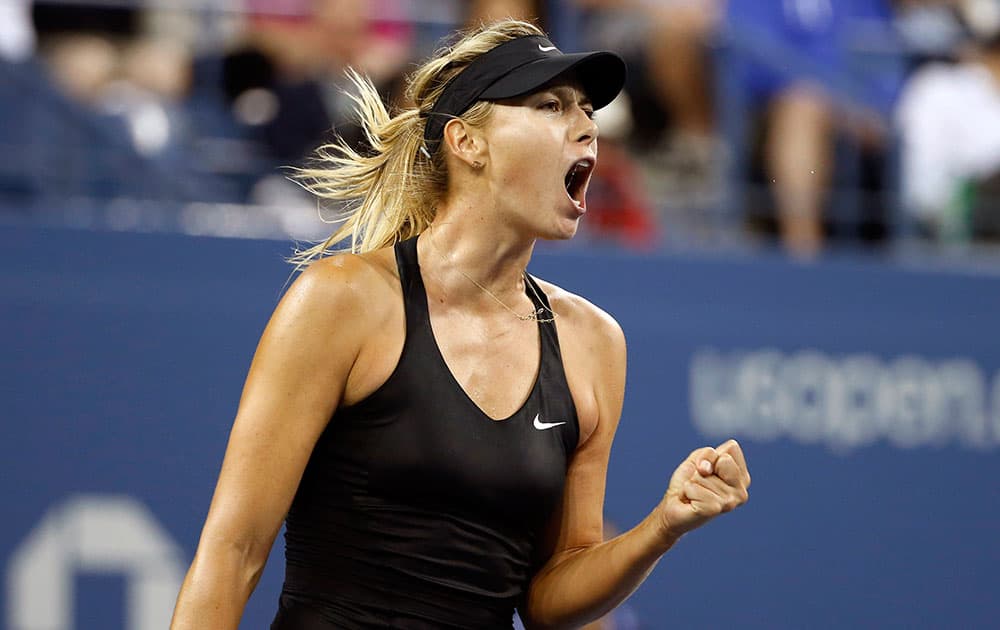 Maria Sharapova, of Russia, reacts after winning a game against Sabine Lisicki, of Germany, during the third round of the US Open tennis tournament.