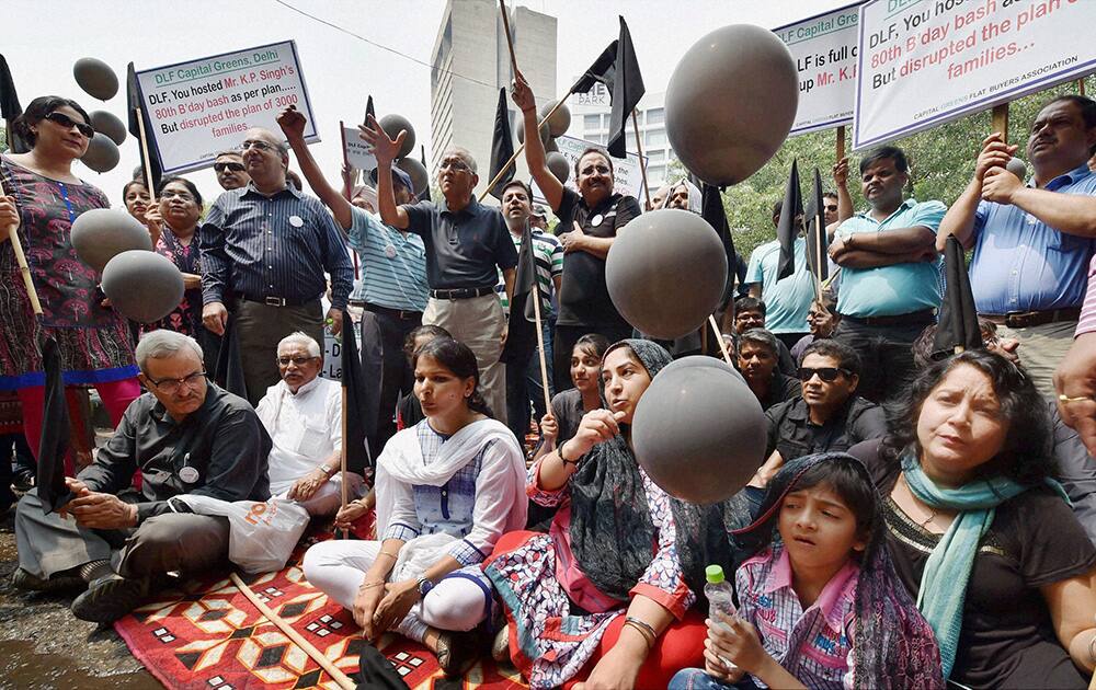 Flat owners under the banner of Capital Green Flat Buyers Association protesting against DLF due to delayed delivery of flats at DLF's Corporate Office in New Delhi.