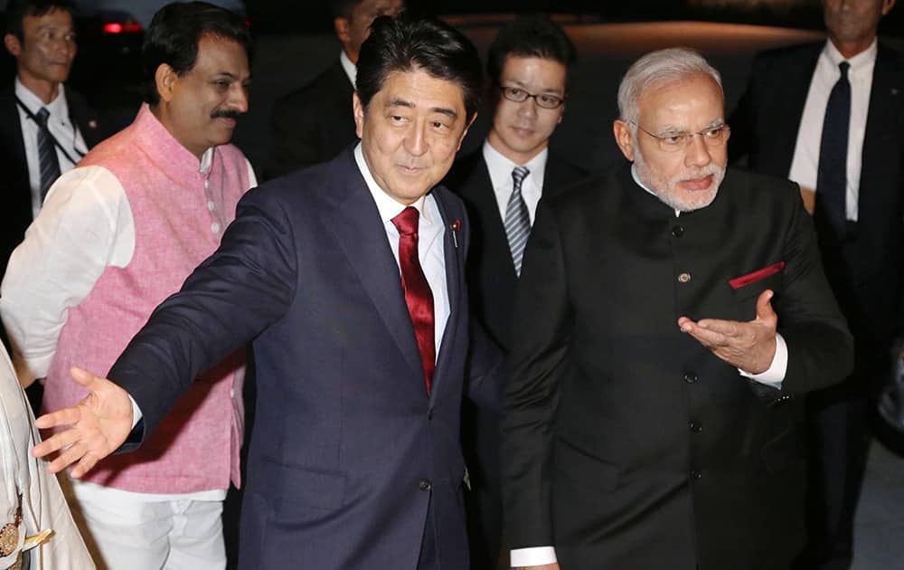 Prime Minister Narendra Modi, right, is greeted by his Japanese counterpart Shinzo Abe, left, upon arrival at the State Guest House in Kyoto.