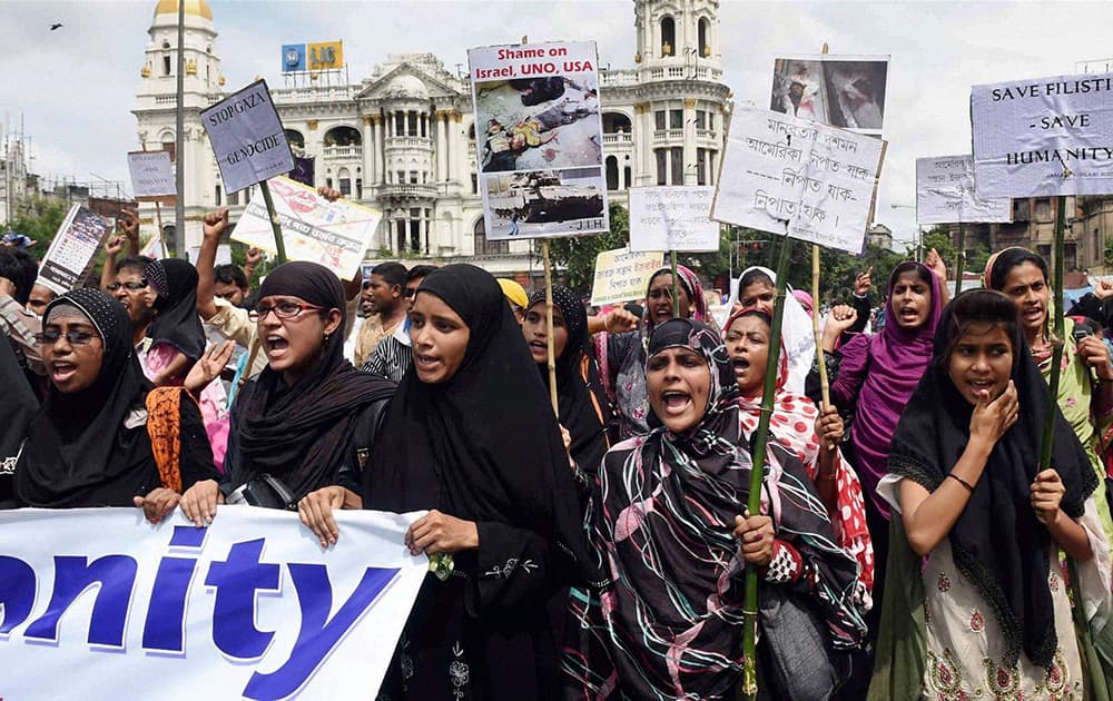 Members of Jamaat-e-Islami Hind take part in a protest rally against killings in Palestine in Kolkata.