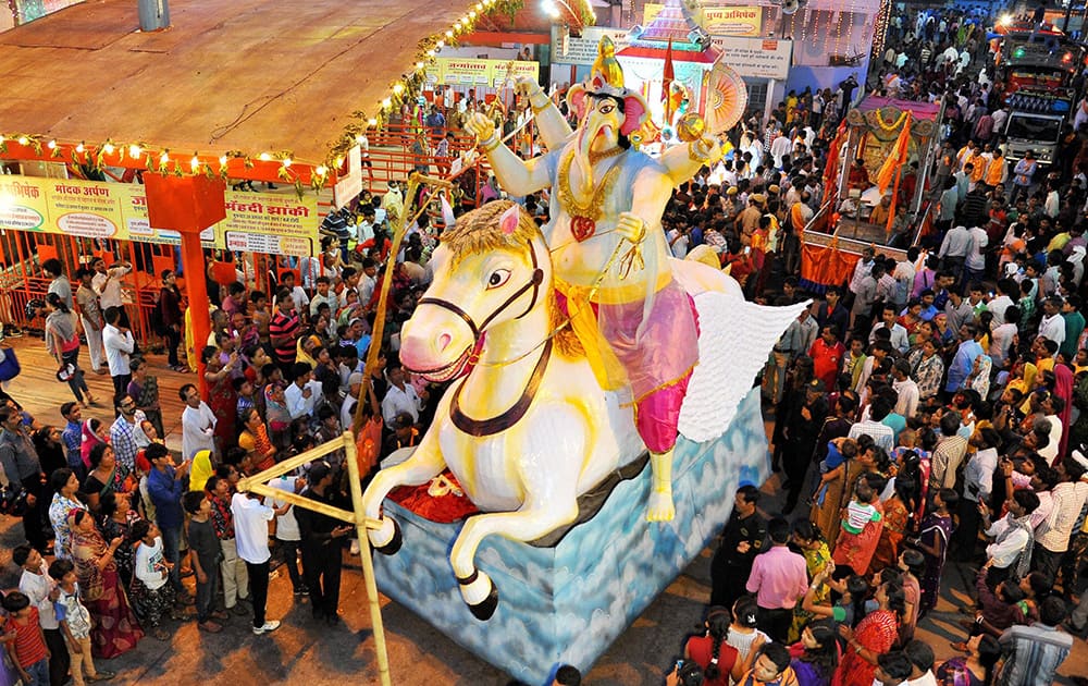 People take part in a procession in Jaipur on Saturday, a day after the festival of Ganesh Chaturthi.