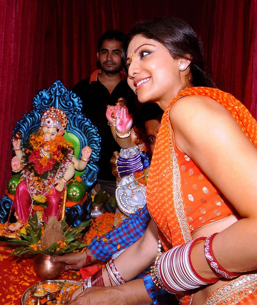 Bollywood actor Shilpa Shetty participates in a procession for the immersion of an idol of the elephant-headed Hindu god Lord Ganesha in Mumbai.