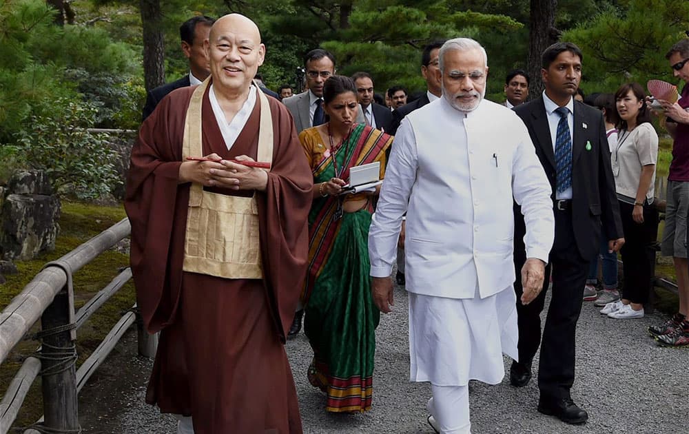 Prime Minister Narendra Modi along with head priest during his visit to the Kinkaku-ji Temple, the Zen Buddhist temple in Kyoto.