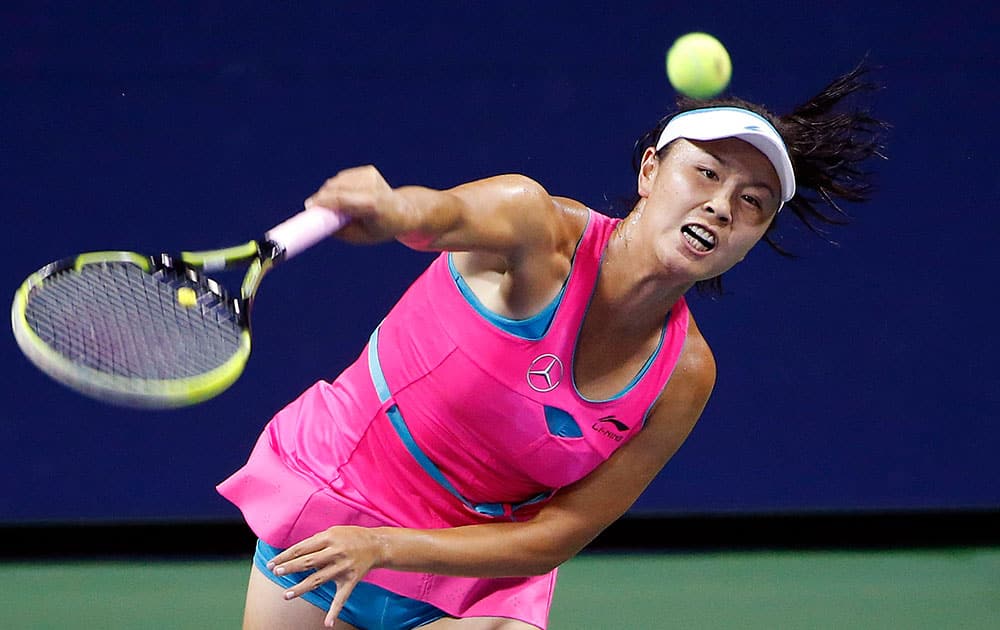 Shuai Peng, of China, serves to Lucie Safarova, of Czech Republic, during the fourth round of the US Open tennis tournament.