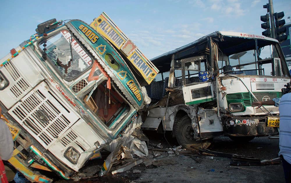 The wreckage of a bus and a truck after a collision in Noida.