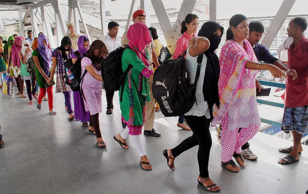 Teen-aged Assamese girls who were rescued by the CID from a fish factory in Mumbai, upon their arrival in Guwahati.