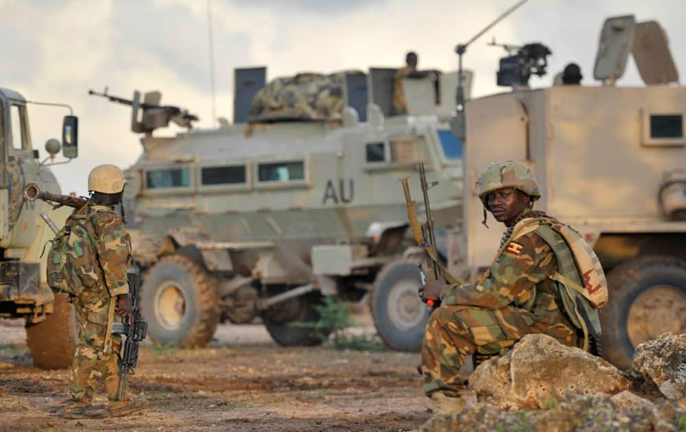 African Union (AU) soldiers from Uganda rest in the town of Kurtunwarey in Somalia.