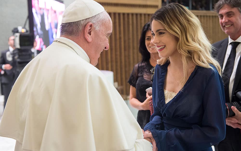 Pope Francis greets Argentine actress and singer Martina Stoessel, who portrays Disney Channel's 