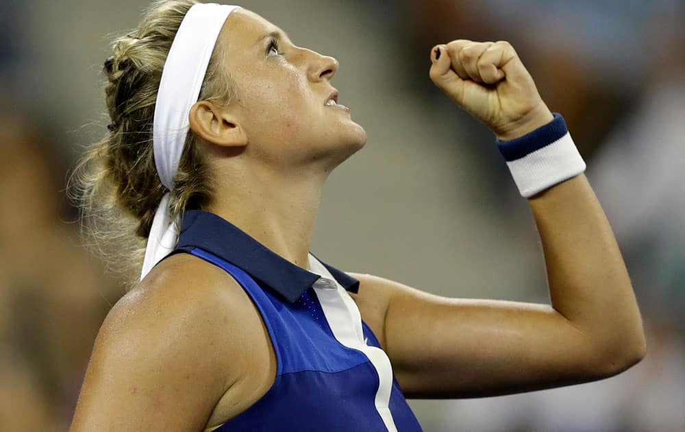 Victoria Azarenka, of Belarus, reacts after a point during a math against Aleksandra Krunic, of Serbia, during the fourth round of the 2014 US Open tennis tournament.