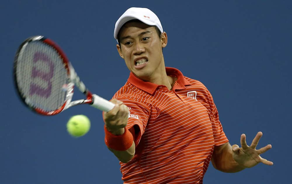 Kei Nishikori, of Japan, returns a shot to Milos Raonic, of Canada, during the fourth round of the 2014 US Open tennis tournament.