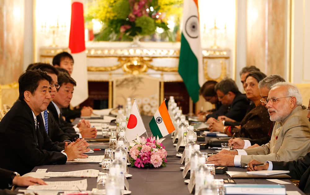 Prime Minister Narendra Modi, second right, and Japanese Prime Minister Shinzo Abe, left, talk during their meeting at the Akasaka State Guesthouse in Tokyo.