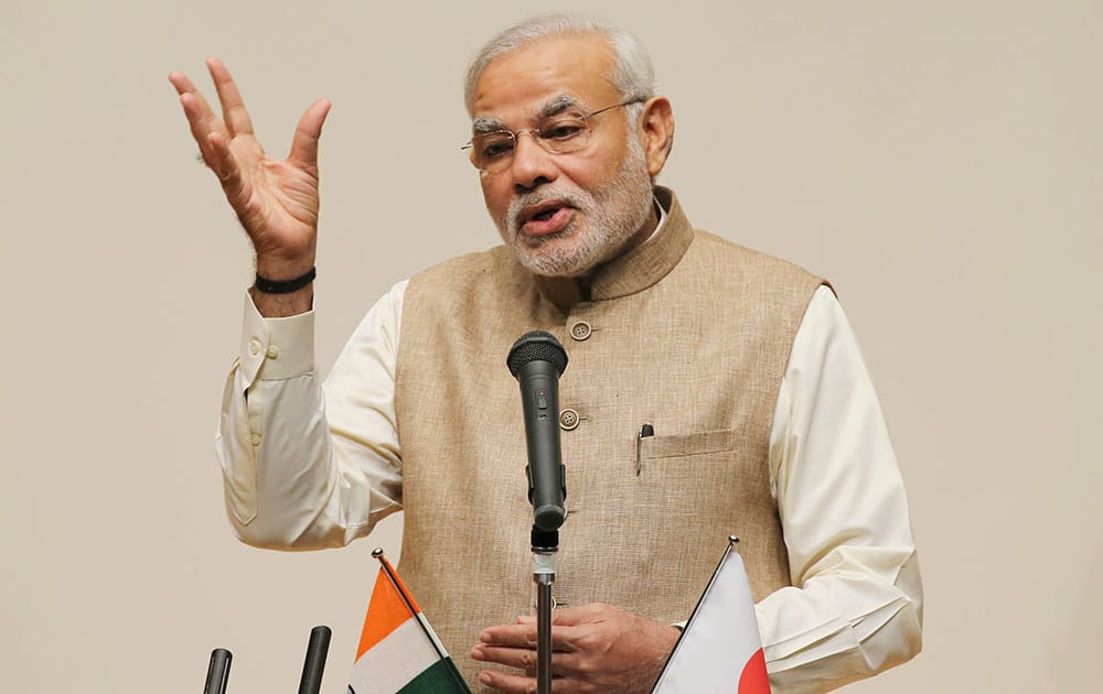 Prime Minister Narendra Modi delivers a speech during his lecture at the University of the Sacred Heart in Tokyo.