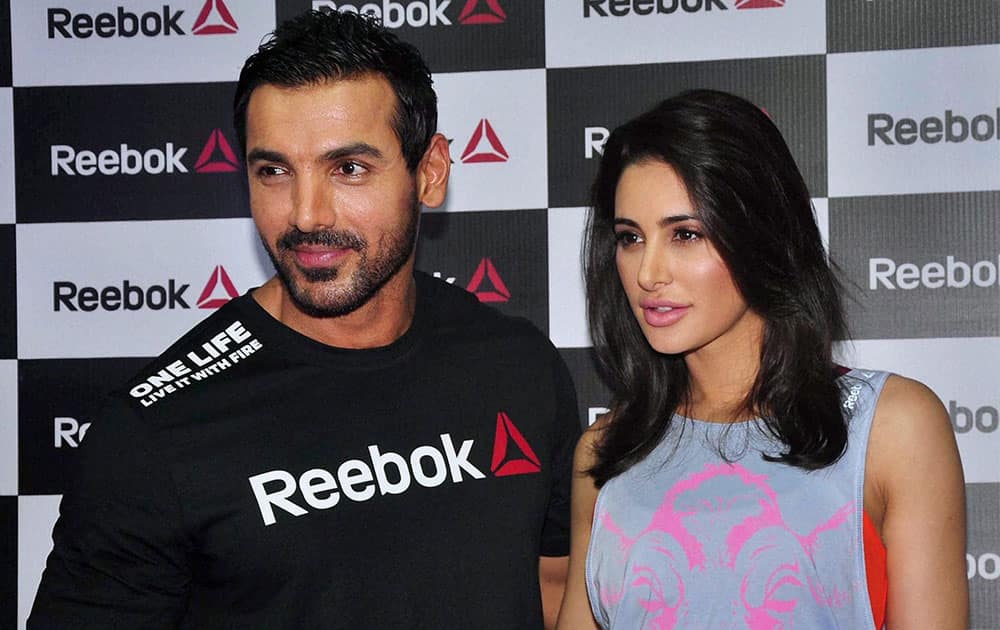 Bollywood actors John Abraham and Nargis Fakhri during a promotional event in Mumbai.