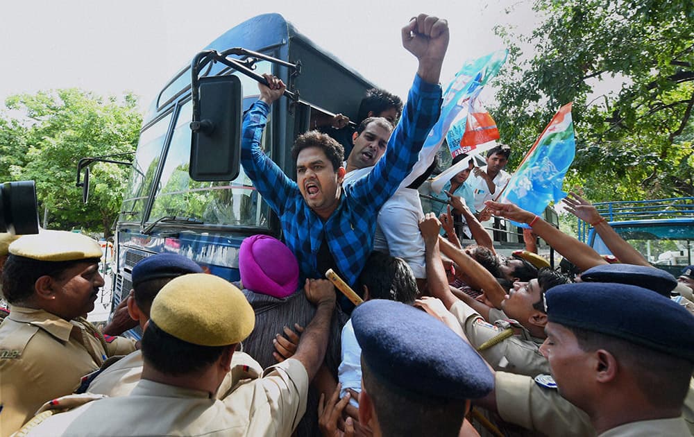 Police detain NSUI activists during a protest outside the residence of Union Home Minister Rajnath Singh over the issue of black money in New Delhi.