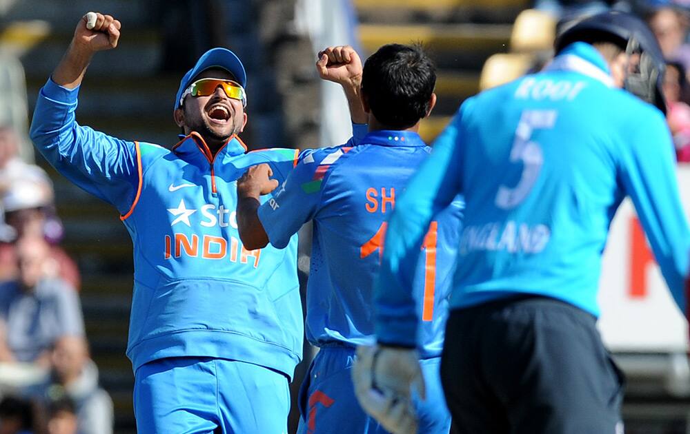 Suresh Raina celebrates after England's Gary Ballance is bowled by Mohammed Shami, caught Ajinkya Rahane for 7 runs during the fourth One Day International match between England and India at Edgbaston cricket ground, Birmingham, England.