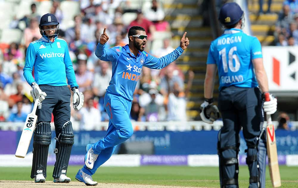 Ravindra Jadeja celebrates after bowling England's Eoin Morgan caught Suresh Raina for 32 runs during the fourth One Day International match between England and India at Edgbaston cricket ground, Birmingham.