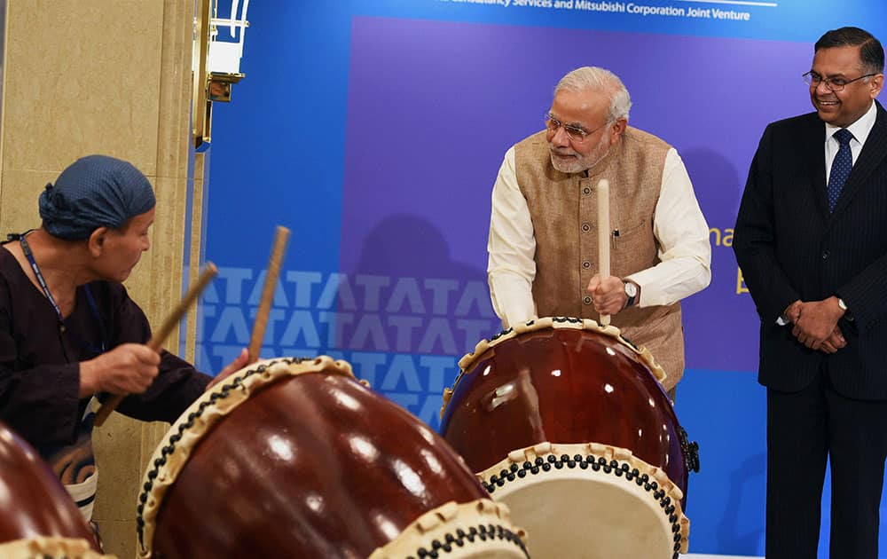 Prime Minister Narendra Modi beats a traditional Taiko drum during inauguration of the Tata Consultancy Services (TCS) Japan Technology and Culture Academy in Tokyo.