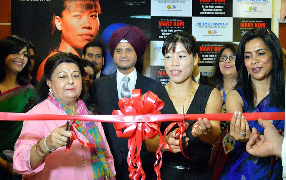 World boxing champion MC Mary Kom cuts ribbon at an event to raise awareness on women's cancer and cardiac diseases in Gurgaon.