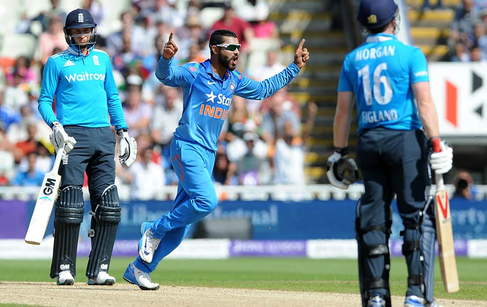 Ravindra Jadeja celebrates after bowling England's Eoin Morgan caught Suresh Raina for 32 runs during the fourth One Day International match between England and India at Edgbaston cricket ground, Birmingham, England.