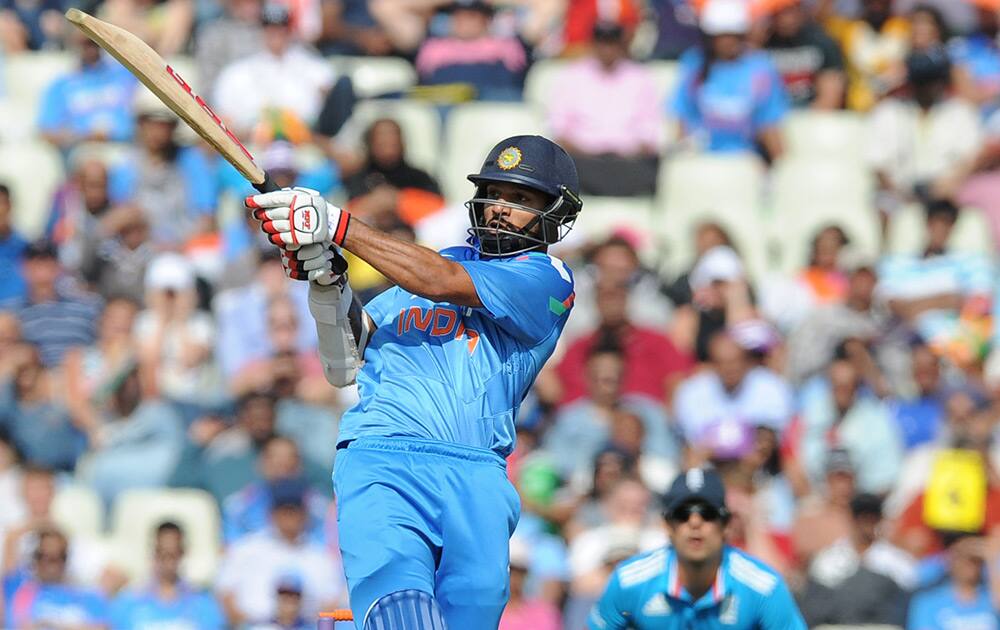 Shikhar Dhawan plays a shot during the fourth One Day International match between England and India at Edgbaston cricket ground, Birmingham, England.