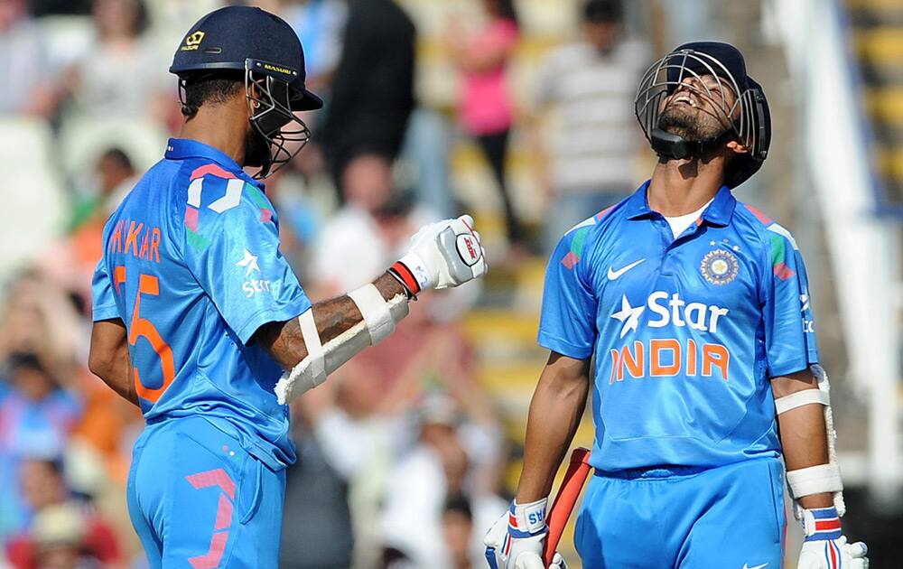 Ajinkya Rahane looks to the sky as reaches half a century during the fourth One Day International match between England and India at Edgbaston cricket ground, Birmingham, England.