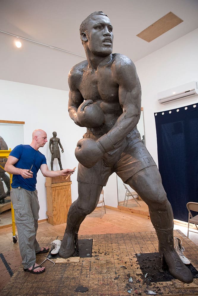 Artist Stephen Layne works on a sculpture of boxing heavyweight champion Joe Frazier in Philadelphia. Next year, the sculpture is expected to be placed near the city's sports stadiums, ending a hurdle-strewn saga that included fundraising problems and the death of the original sculptor. Frazier died in 2011.