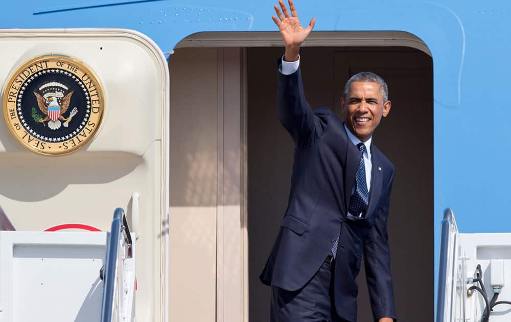 President Barack Obama waves as he boards Air Force One before leaving from Andrews Air Force Base, Md., for a trip to Estonia, in a show of solidarity with one of the countries that could benefit from NATO’s plans to expand its military presence in Eastern Europe.