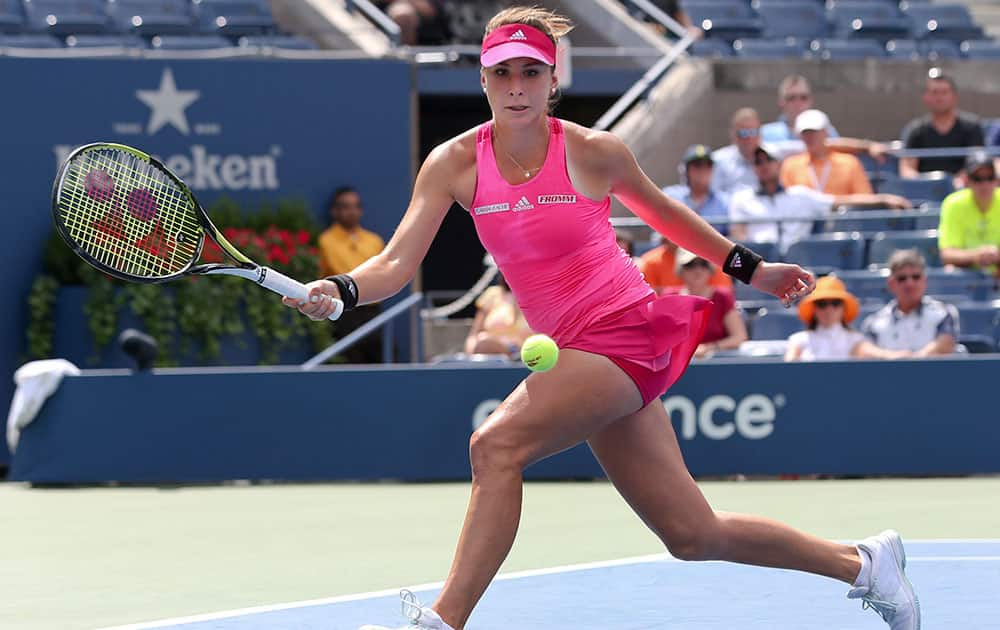 Belinda Bencic, of Switzerland, chases down a shot against Peng Shuai, of China, during the quarterfinals of the 2014 US Open tennis tournament.