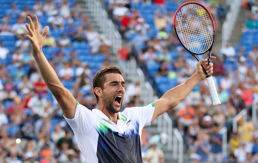 Marin Cilic, of Croatia, reacts after defeating Gilles Simon, of France, in five sets during the fourth round of the 2014 US Open tennis tournament.