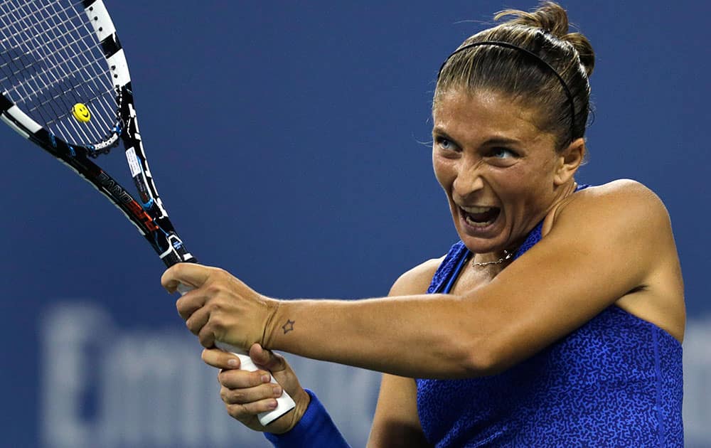 Sara Errani, of Italy, returns to Caroline Wozniacki, of Denmark, during the quarterfinals of the US Open tennis tournament.