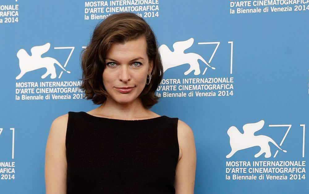 Actress Milla Jovovich poses for photographers during the photo call for the movie Cymbeline at the 71st edition of the Venice Film Festival in Venice, Italy.