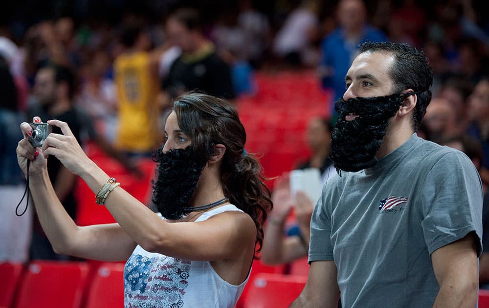 United States fans wear fake beards representing US player James Harden, before the Group C Basketball World Cup match between United States and Dominican Republic, in Bilbao northern Spain.